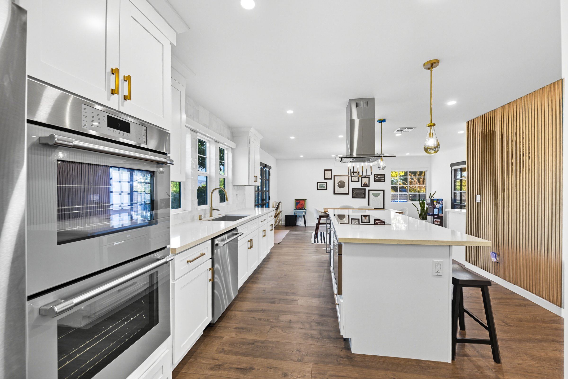 Modern kitchen with Thermador appliances and quartz island