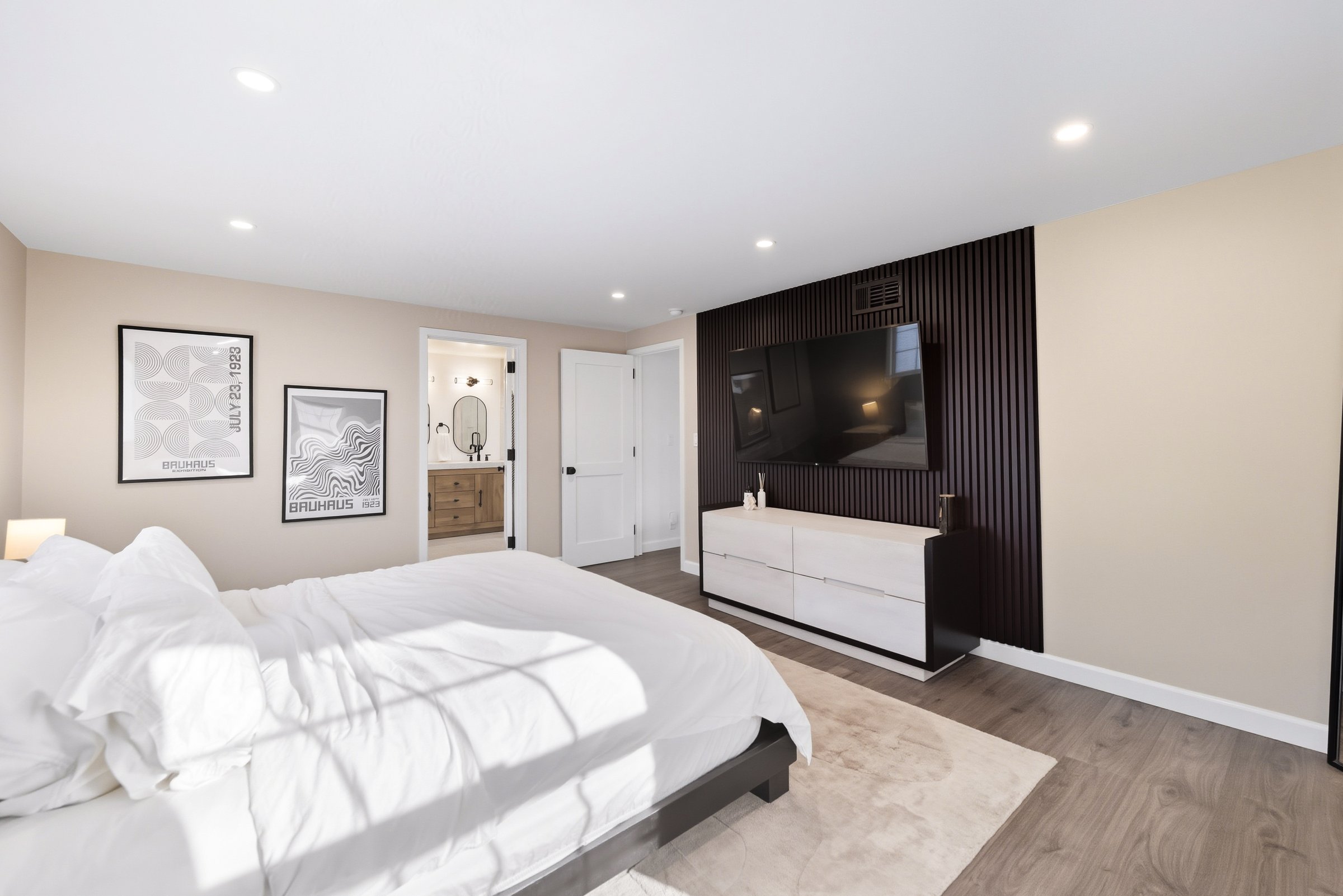 Primary suite with natural light and walk-in closet